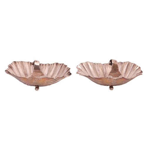 316 - A pair of Victorian silver scallop shell dishes, London by Jackson & Deere, with scroll handles and ... 