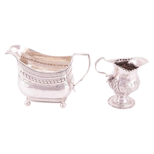 317 - Two George III silver cream jugs; including a baluster stemmed jug, by William Cripps, London 1770, ... 