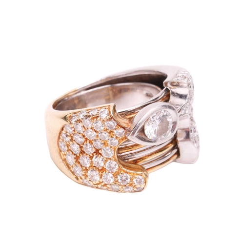 32 - A diamond dress ring in an abstract design, featuring a round brilliant cut diamond with an estimate... 