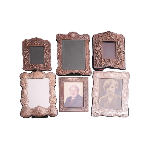 320 - Six decorative silver and white metal fronted easel photograph frames, mixed dates and makers.