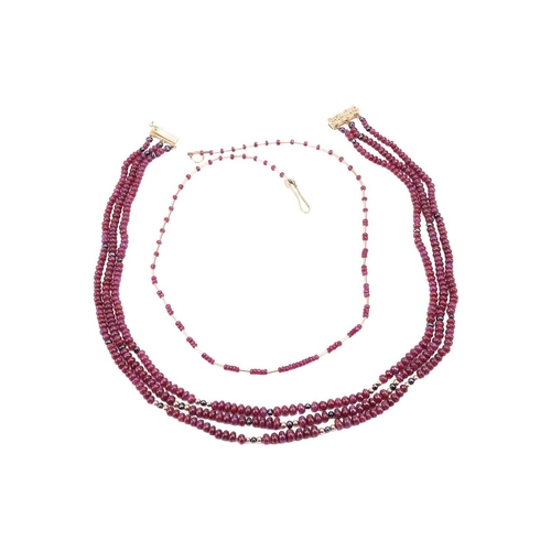 36 - Two ruby beaded necklaces with 18ct gold clasps; the first containing three strands of ruby beads wi... 