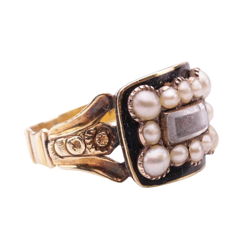 4 - An early Victorian mourning ring set with split pearls and enamel, the curved rectangular panel cent... 