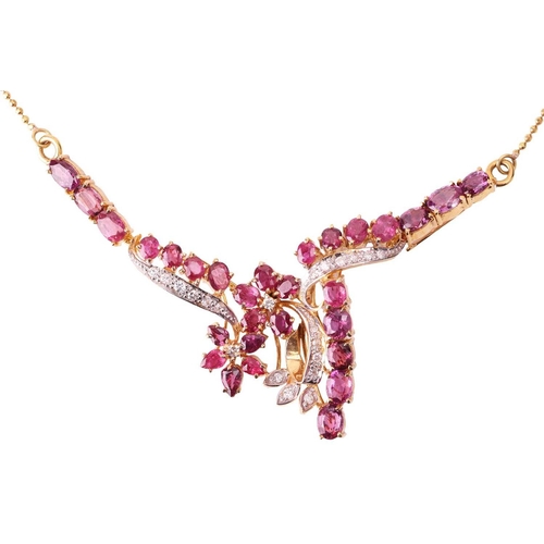 43 - A ruby and diamond necklace; the centre set with foliate sprays of round brilliant cut diamonds and ... 