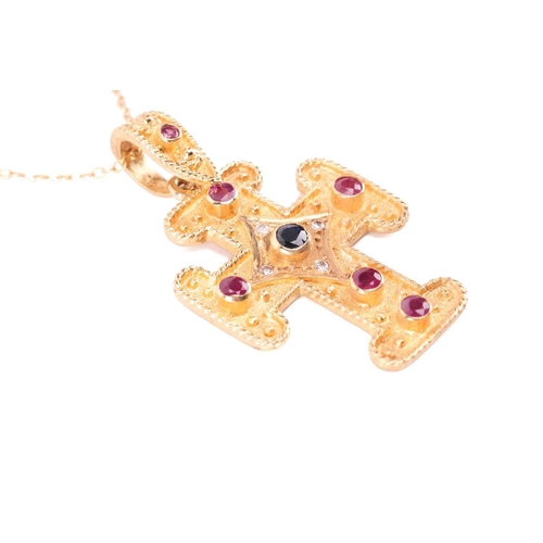 45 - A gem-set cross pendant on chain, containing circular-cut rubies and sapphires along with diamond ac... 