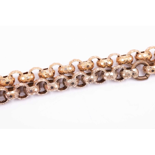 46 - An Early 19th Century pinchbeck guard chain with gem-set barrel clasp, comprising a series of emboss... 