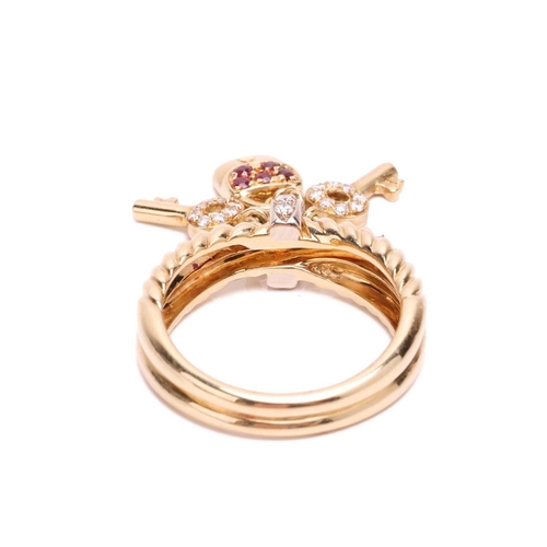 47 - A gem-set key and lock charm ring, of crossover rope design, with a diamond-set loop in the centre, ... 