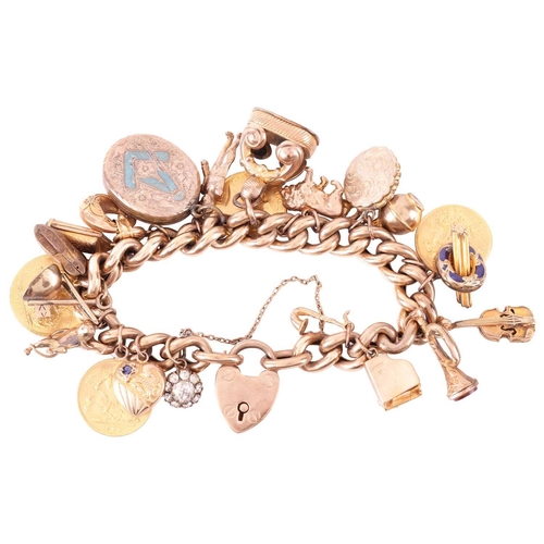 48 - A 9ct gold charm bracelet, suspending 22 various charms. The curb link chain terminates with a 9ct g... 