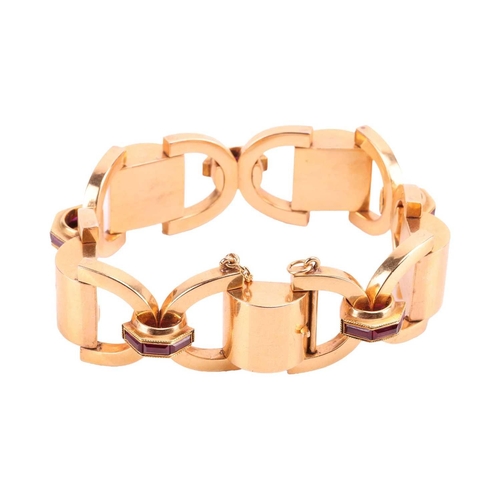 50 - A chunky fancy link bracelet set with calibré-cut synthetic rubies, superimposed on hollow cross mot... 