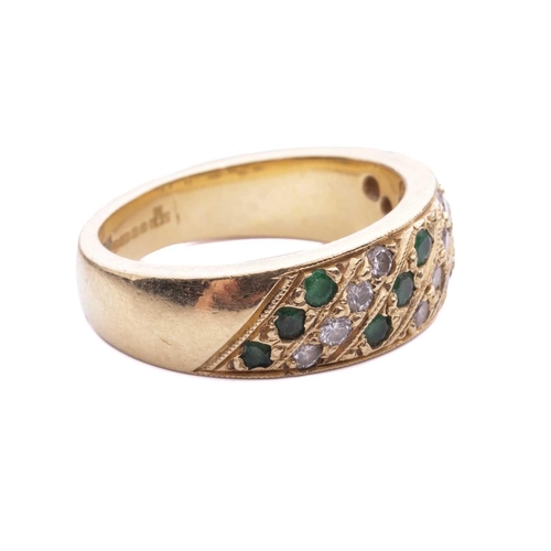 56 - An emerald and diamond-set ring, featuring alternating rows of diamonds and emeralds, grain set in a... 