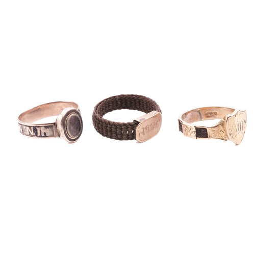 7 - A collection of three mourning rings; comprising an engraved shield shape mourning ring with monogra... 