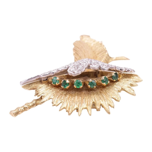 73 - A gem-set spray brooch, of floral design, the yellow metal textured fronds highlighted with six circ... 