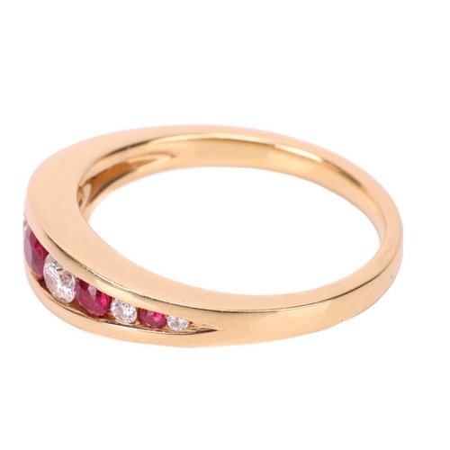 75 - A ruby and diamond-set ring, in 18ct yellow gold, featuring a row of graduated round-cut rubies and ... 