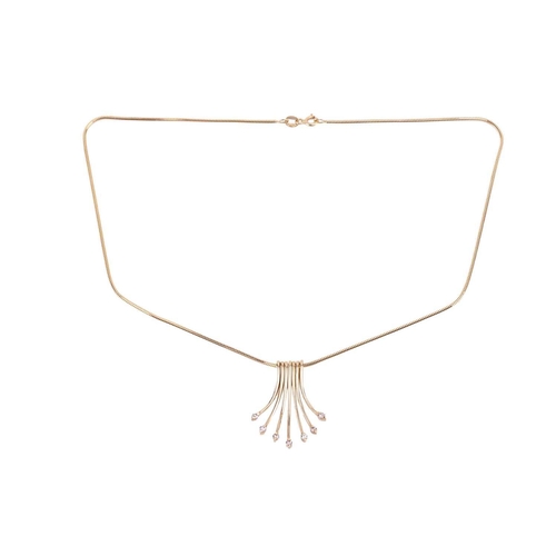 80 - A diamond-set fringe pendant necklace, the snake chain suspending seven graduated drops with diamond... 