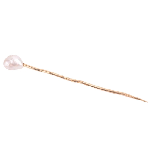 89 - A baroque pearl stick pin, pearl measures approximately 11.3mm x 8.5mm, unmarked yellow metal tests ... 