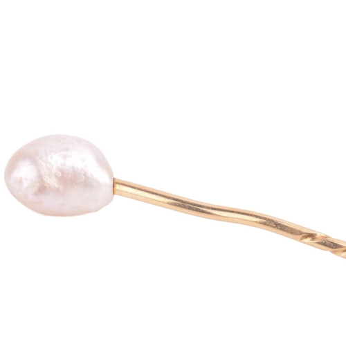 89 - A baroque pearl stick pin, pearl measures approximately 11.3mm x 8.5mm, unmarked yellow metal tests ... 