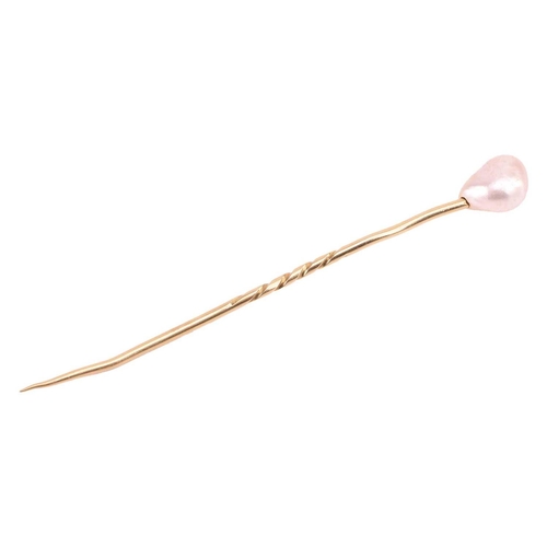 89 - A baroque pearl stick pin, pearl measures approximately 11.3mm x 8.5mm, unmarked yellow metal tests ... 