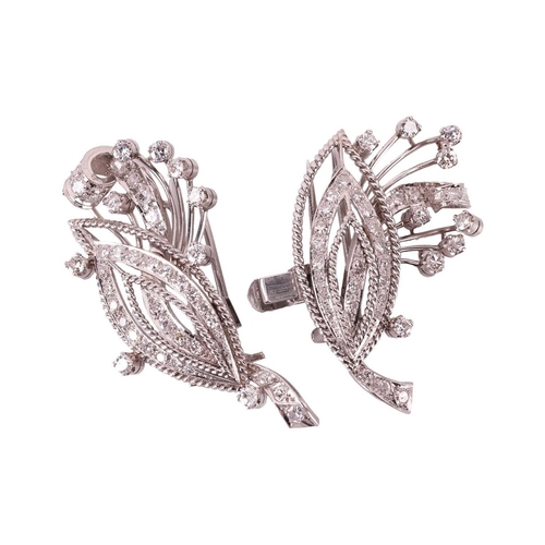 90 - A diamond convertible double-clip spray brooch, each clip with a navette shape motif and spray, set ... 