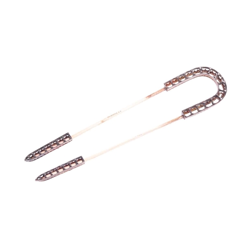 93 - A French hair pin, by Boucheron. Set with small rose-cut diamonds to the horseshoe-shaped frame and ... 