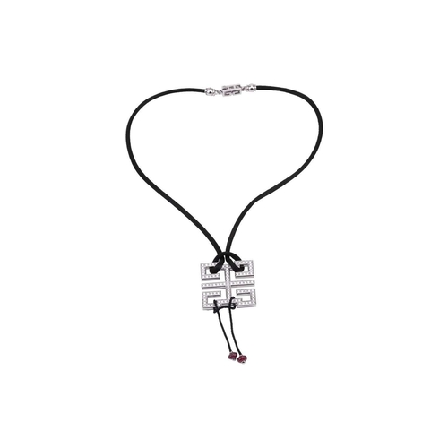 97 - Cartier - a diamond-set 'Le Baiser du Dragon Wishknot' pendant with ruby bead tassels, on a black si... 