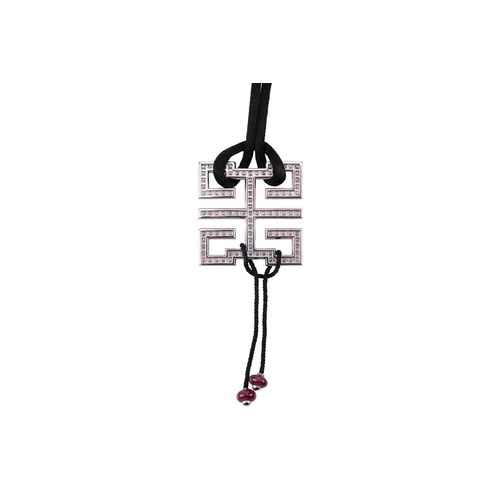 97 - Cartier - a diamond-set 'Le Baiser du Dragon Wishknot' pendant with ruby bead tassels, on a black si... 