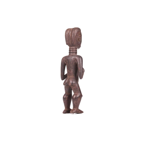 107 - A Dan carved wood fertility standing figure, 20th century, 42 cm high.