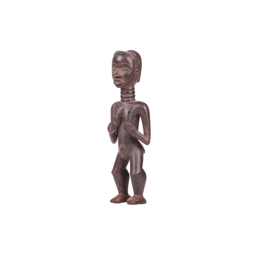 107 - A Dan carved wood fertility standing figure, 20th century, 42 cm high.