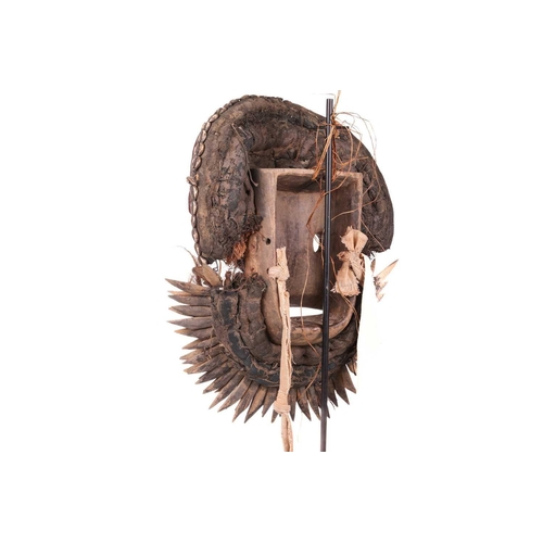 108 - A large Ivory Coast Guerre warrior mask, painted in colours with shell decoration, 20th century, 48 ... 