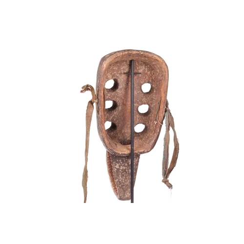 109 - A Grebo ‘Kru’ mask, mid-20th century, 44 cm x 21 cm. NB: Display stand is for illustrative purposes ... 