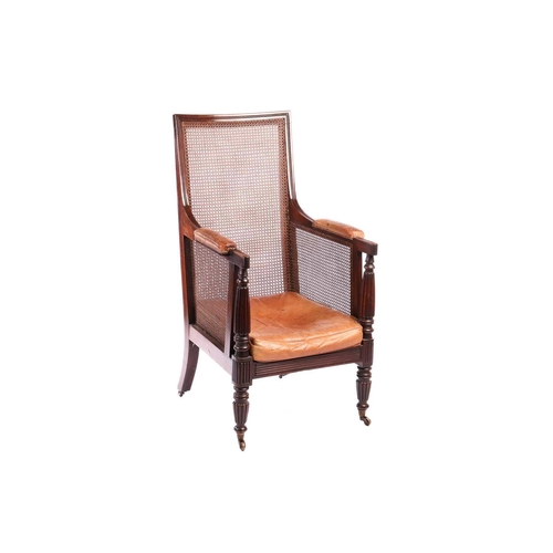 116 - A William IV mahogany bergere library armchair, in the manner of Gillow of Lancaster with square spl... 