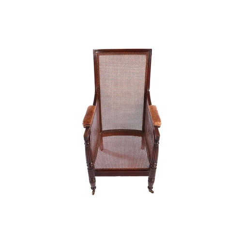 116 - A William IV mahogany bergere library armchair, in the manner of Gillow of Lancaster with square spl... 