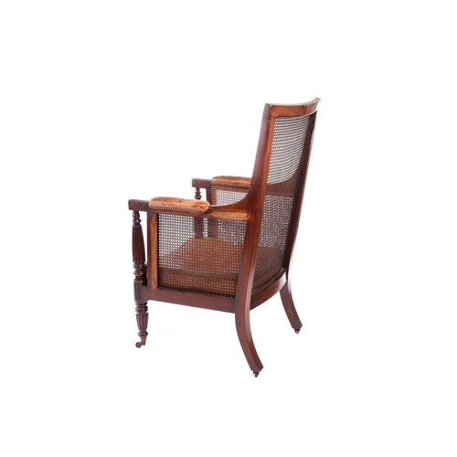 116 - A William IV mahogany bergere library armchair, in the manner of Gillow of Lancaster with square spl... 