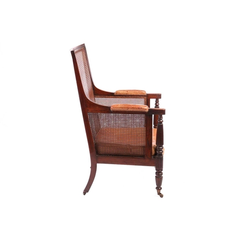 116 - A William IV mahogany bergere library armchair, in the manner of Gillow of Lancaster with square spl... 