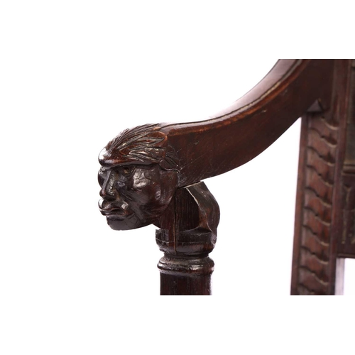 119 - An oak wainscot armchair, 17th century and later, with carved decoration, the arms terminating in ca... 