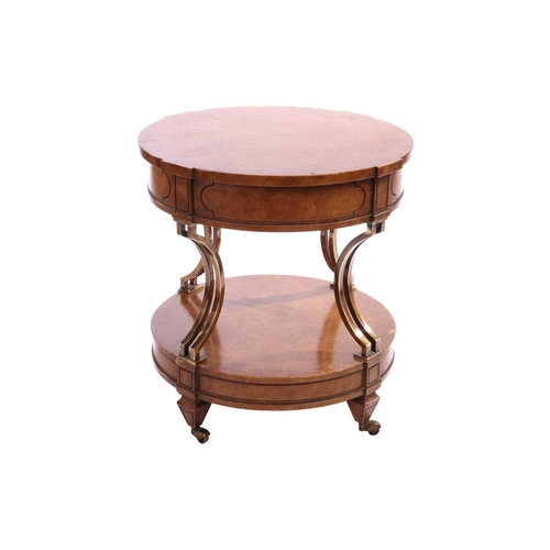 120 - A French Empire-style two-tier drum burr walnut table with concave gilt brass supports over a confor... 