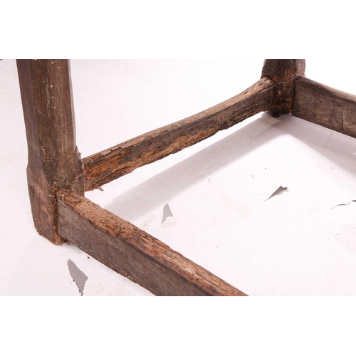 131 - A rustic oak rectangular tavern table, 17th/18th century and later repairs, with a broad planked and... 