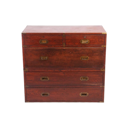 133 - A late Victorian teakwood two-section campaign chest of two short over three long drawers, with sunk... 