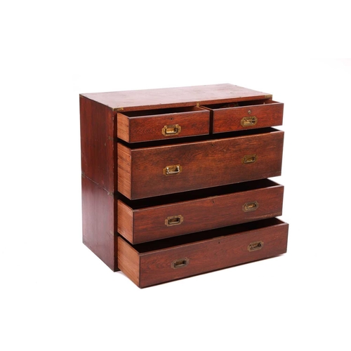 133 - A late Victorian teakwood two-section campaign chest of two short over three long drawers, with sunk... 