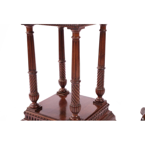 135 - An Edwardian mahogany two-tier pedestal of architectural, form with dentil moulding and fluted colum... 