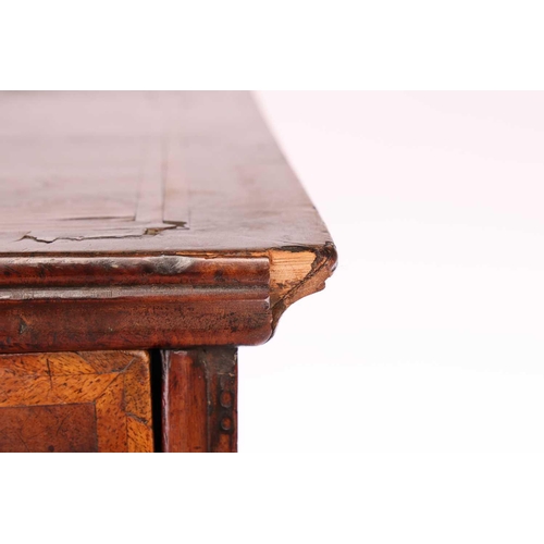 136 - A 17th-century and later figured walnut chest on stand, the upper section with quarter veneered top ... 