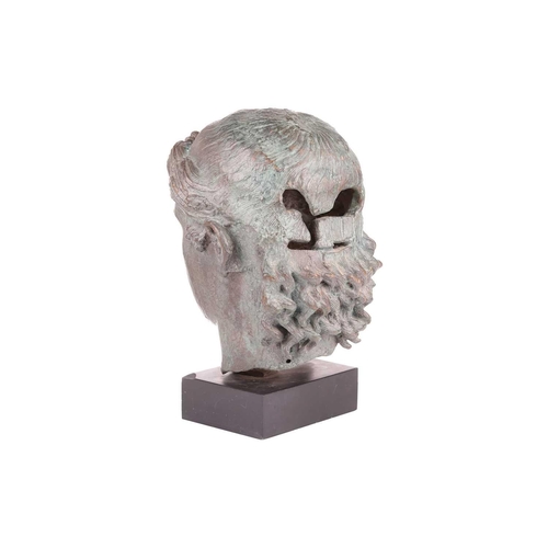 153 - A Grand Tour style patinated bronze, cast after the Chatsworth Apollo Head, raised on a rectangular ... 