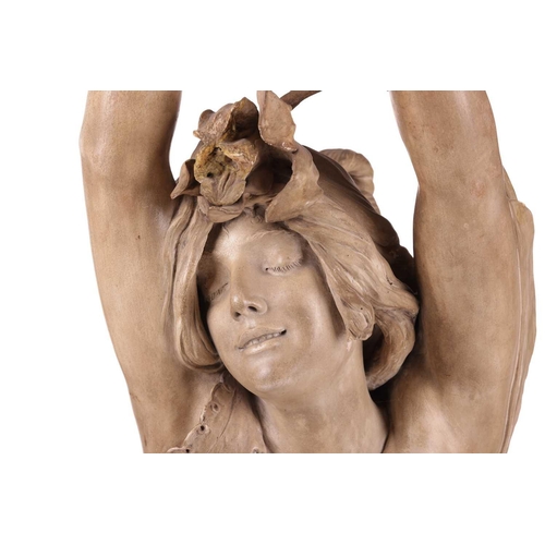 165 - A large Art Nouveau earthenware figure, in the manner of Goldscheider, formed as a semi-nude female ... 