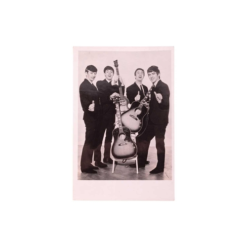 175 - The Beatles: an original black and white signed postcard, early 1960s, with dedication verso in John... 