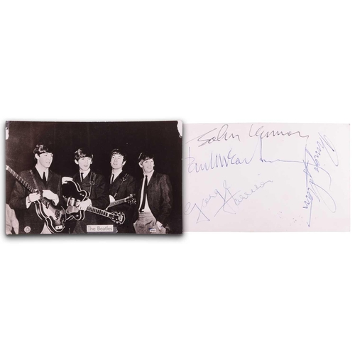 176 - The Beatles: a black and white photographic postcard, signed verso by Paul McCartney, John Lennon, R... 