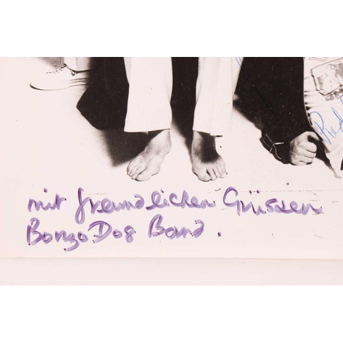 330 - The Bonzo Dog Doo-Dah Band: a fully signed black and white photograph of the band, with the signatur... 