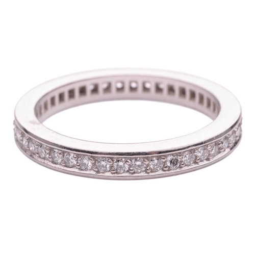 101 - A diamond-set full eternity ring, featuring round brilliant diamonds, with an estimated total carat ... 