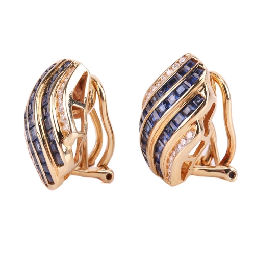 108 - A pair of gem-set earclips, the curved rows set with calibre-cut sapphires and round brilliant diamo... 