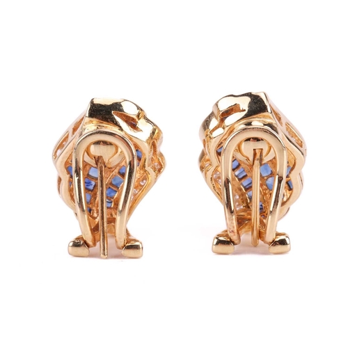 108 - A pair of gem-set earclips, the curved rows set with calibre-cut sapphires and round brilliant diamo... 