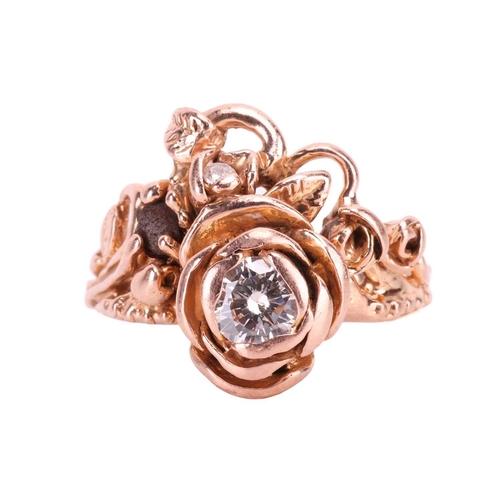 11 - A diamond ring designed as a spray of roses, set with a round brilliant-cut diamond with an estimate... 