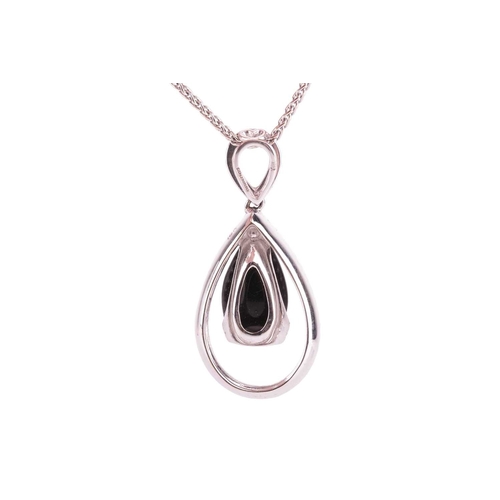 110 - A jet and diamond-set pendant, featuring a pear-shaped jet cabochon, in a diamond-set open drop 18ct... 