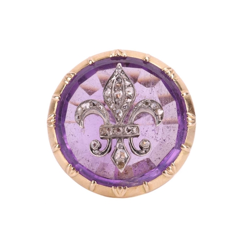 114 - An amethyst fleur-de-lis cocktail ring, the fleur-de-lis emblem set with rose cut diamonds and mount... 